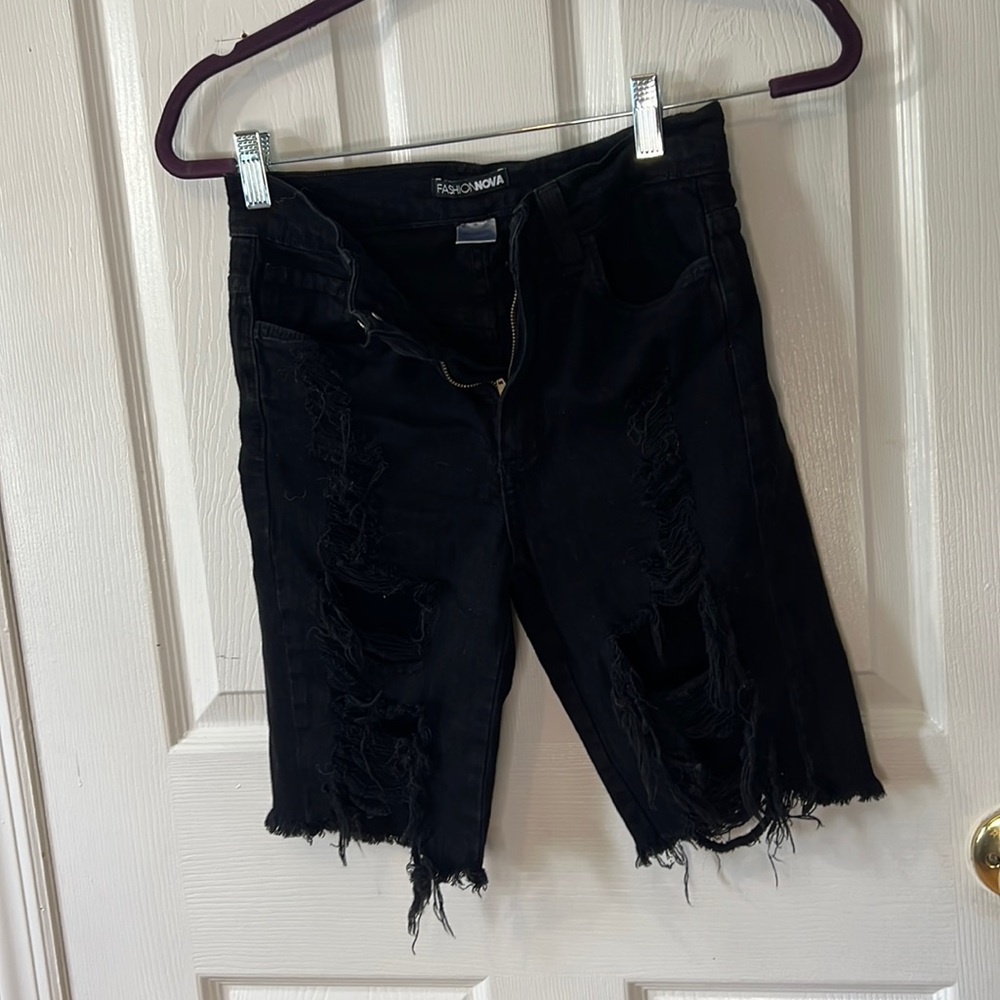 Black ripped bermuda shorts